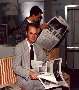 [Sebastian and Dirk reading newspaper]